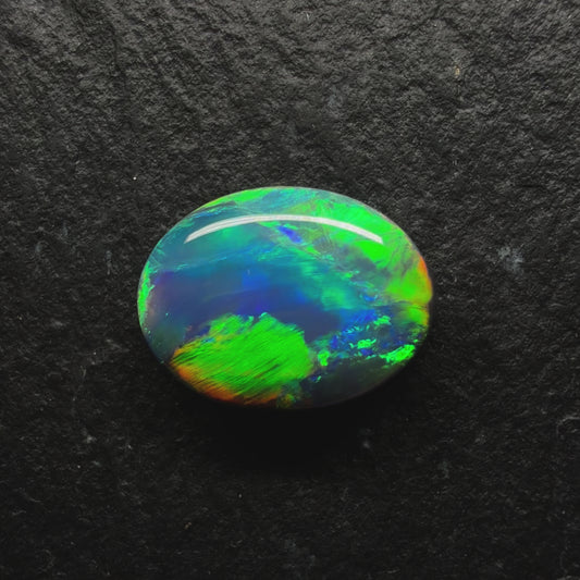 1.6ct Gem Black Opal With A Lovely Green-Gold Color palette With Hints OF Teal And A Mixed Patterns