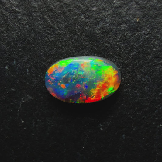 0.6ct Gem Black Opal With A Brilliant Multi Color Palette And Mixed Patterns