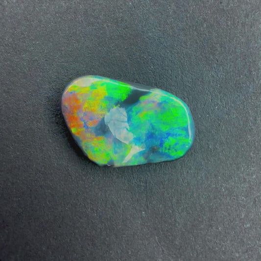 1.82cts Black Opal Carving With A Red Pink Multicolor Play Of Color, From Lightning Ridge Australia