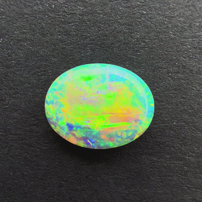 0.75cts Crystal Opal With A Green Yellow Gold Play Of Color, From Lightning Ridge Australia