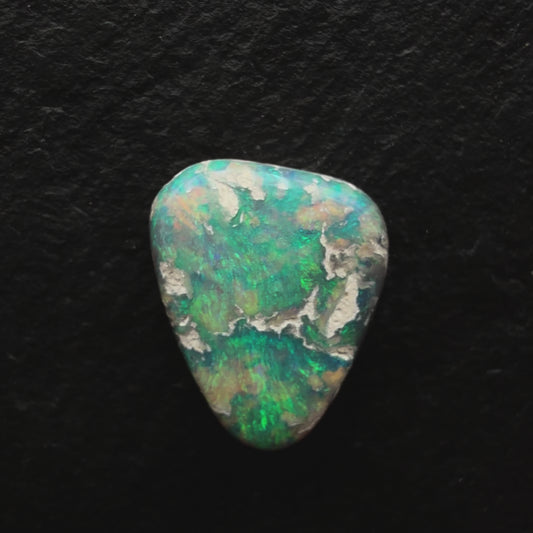 2.85ct Picture Stone Dark Opal With A Tropical Blue Green Color And Sandy colored Inclusions