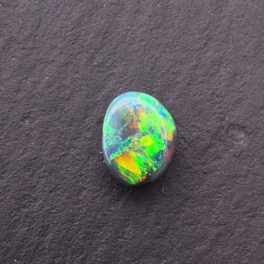 0.85cts Black Opal With A Green, Yellow, Gold, Play Of Color, From Lightning Ridge Australia