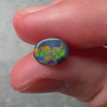 0.74ct Black Opal With A Red, Pink, Multicolor Play Of Color, From Lightning Ridge Australia