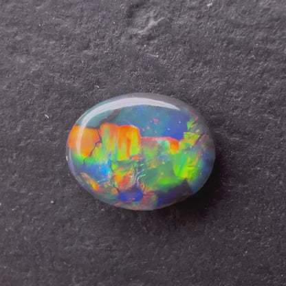 0.74ct Black Opal With A Red, Pink, Multicolor Play Of Color, From Lightning Ridge Australia