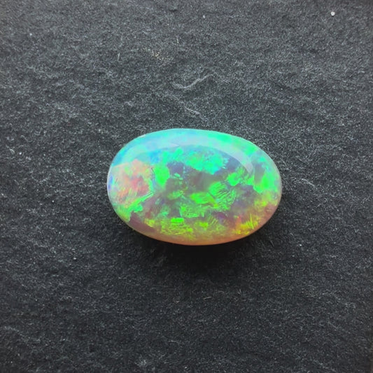 1.31cts Crystal Opal with a Green Yellow Gold Play of Color, From Lightning Ridge Australia
