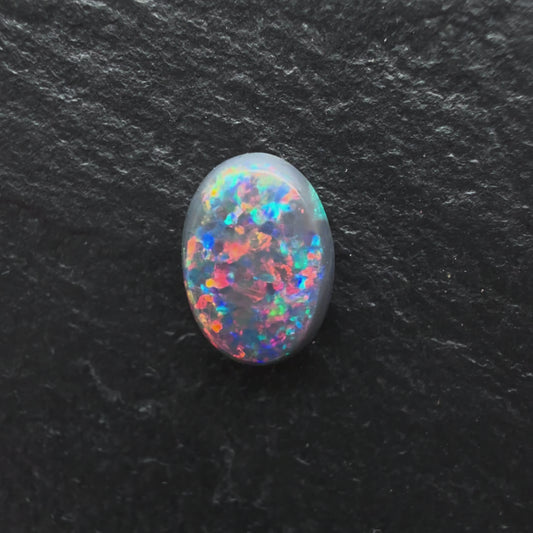 1.0ct Gem Black opal with A Beautiful Red-Blue Pinfire Pattern