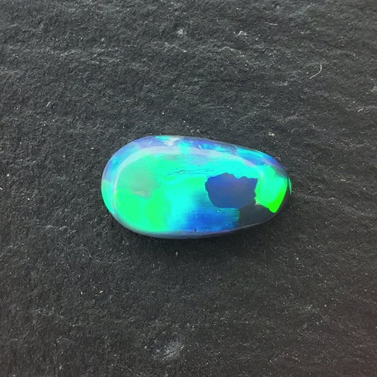 0.86ct Semi-Black Opal With A Green, Blue Play Of Color, From Lightning Ridge Australia