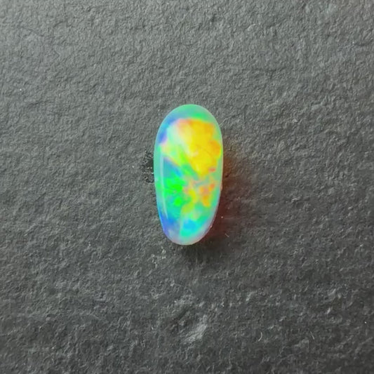0.57 Crystal Opal With A Red, Pink Multicolor Play Of Color, From Lightning Ridge Australia