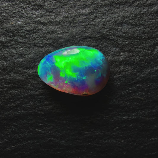 1.02ct Black Opal, This Gem Has A Vivid Green-Gold Rolling Broadflash Pattern