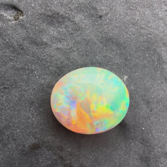 0.9cts Gem Dark Opal With A Green, Yellow, Gold Play Of Color, From Lightning Ridge Australia