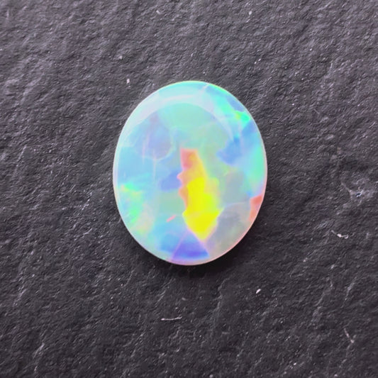 0.62ct Crystal Opal With A Red, Pink Multicolor Play Of Color, From Lightning Ridge Australia