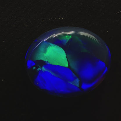 6.8ct Black Opal With A Flagstone Pattern And Color Fading From Aqua To Royal Blue