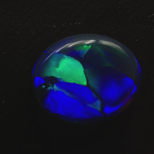 6.8ct Black Opal With A Flagstone Pattern And Color Fading From Aqua To Royal Blue