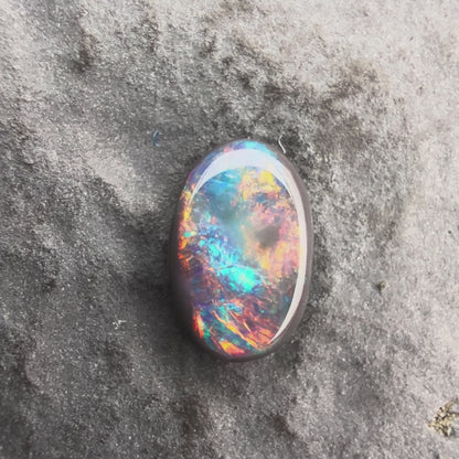 0.61cts Affordable Black Opal With A Vivid Red Pink Multicolor Play Of Color, From Lightning Ridge Australia