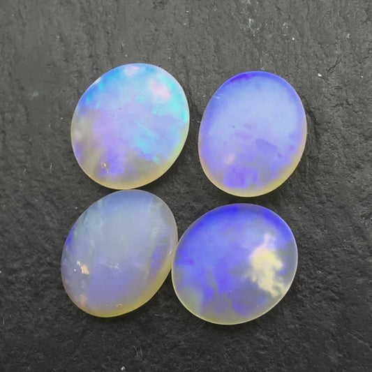 2.2ct Bundle (Price For Parcel) Matte finished opals with a soft purple-green glow
