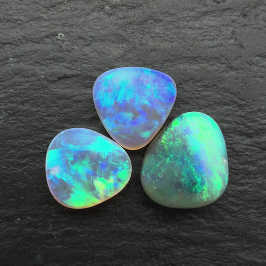 2.3ct Bundle (Price For Parcel) Matte finished opals with a soft purple-green glow