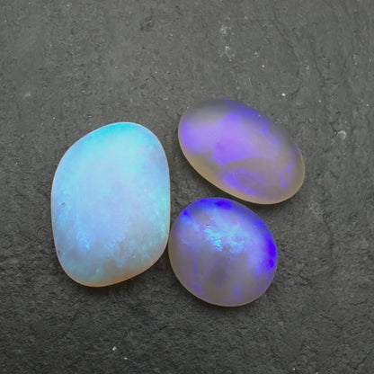 2.2ct Bundle (Price For Parcel) Matte finished opals with a soft purple-green glow