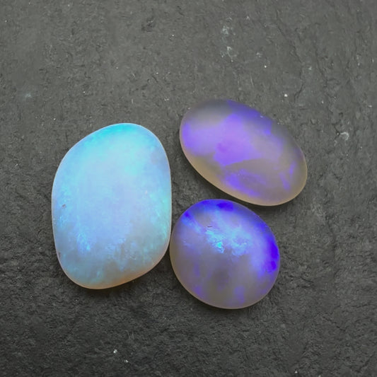 2.2ct Bundle (Price For Parcel) Matte finished opals with a soft purple-green glow