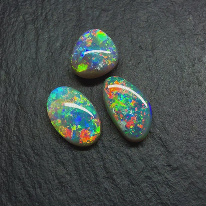 (Price per Stone) Dark opals With vivid Green -Gold Color Palettes and Pinfire Like Patterns