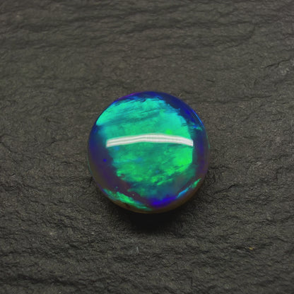 2.2ct Black Crystal Opal. This Gem Has A world Class Cats Eye Pattern And A Rare Teal-Purple Color Palette