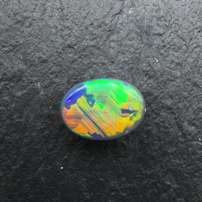 0.56cts Gem Black Opal With Vivid Multicolor And Rare Jigsaw Pattern