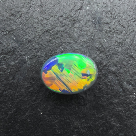 0.56cts Gem Black Opal With Vivid Multicolor And Rare Jigsaw Pattern