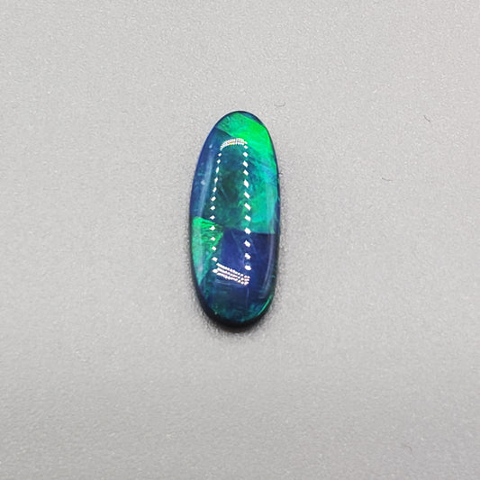 1.5cts Black opal with rolling flash and attractive color segmentation.