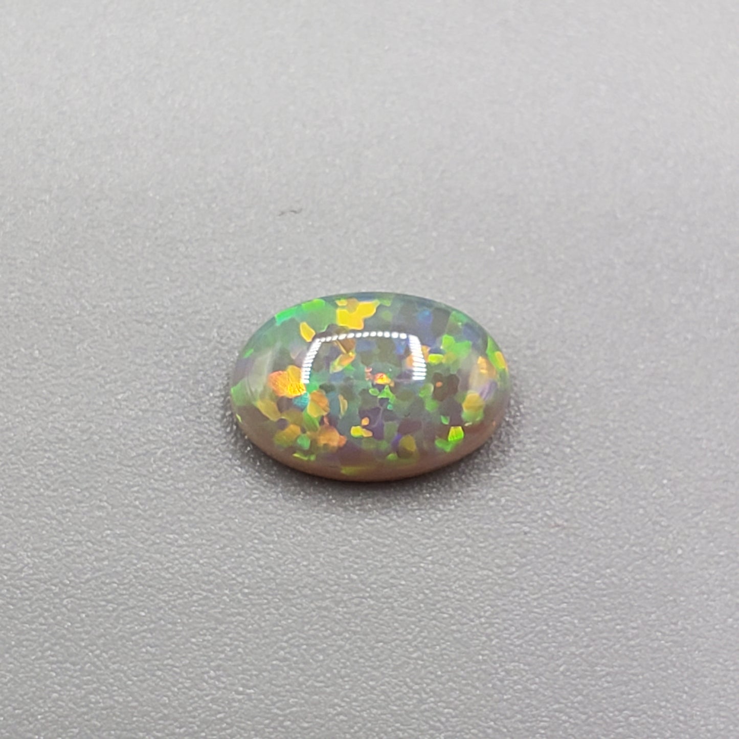 1.4cts Dark opal with a Green- Gold full facing floral pattern