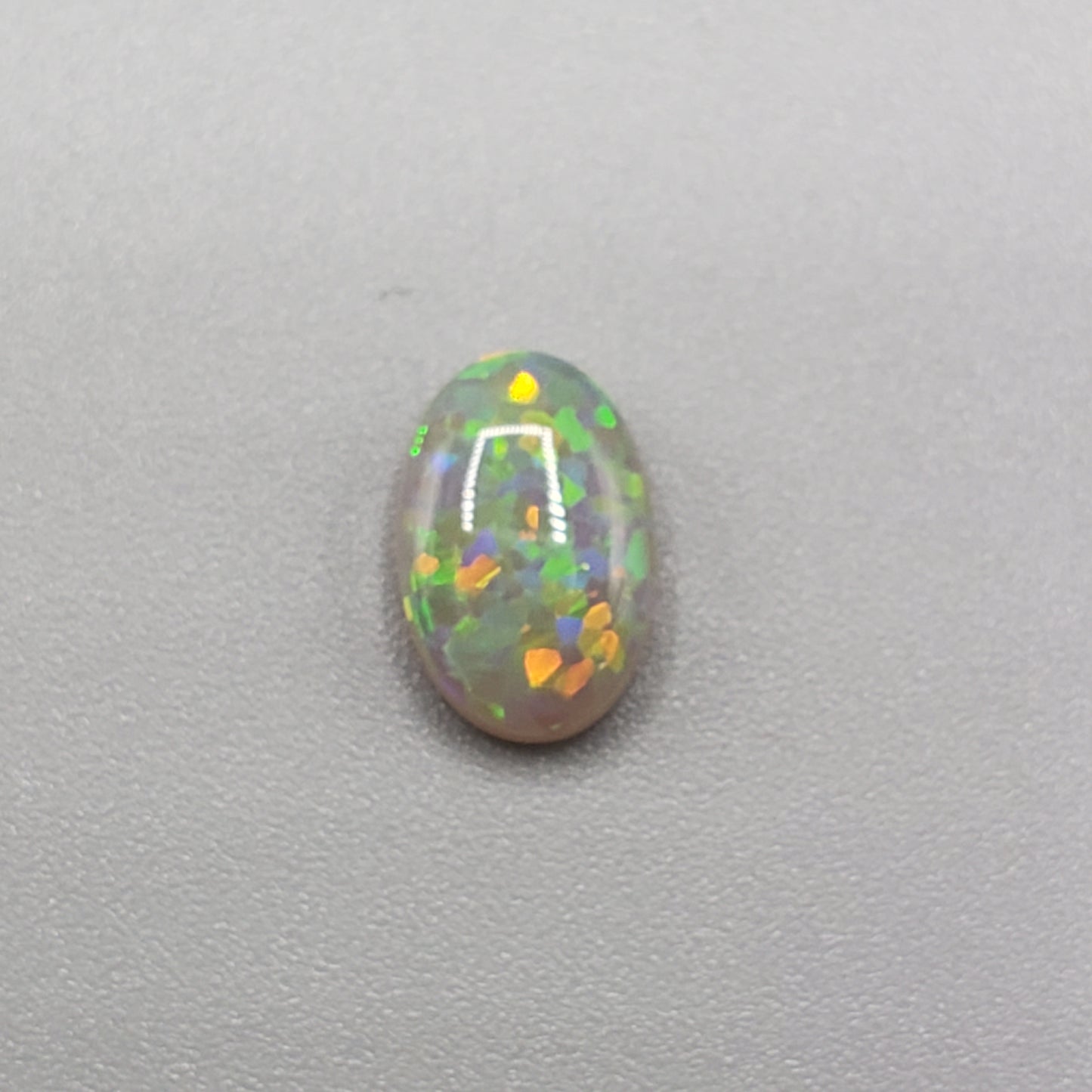 1.4cts Dark opal with a Green- Gold full facing floral pattern