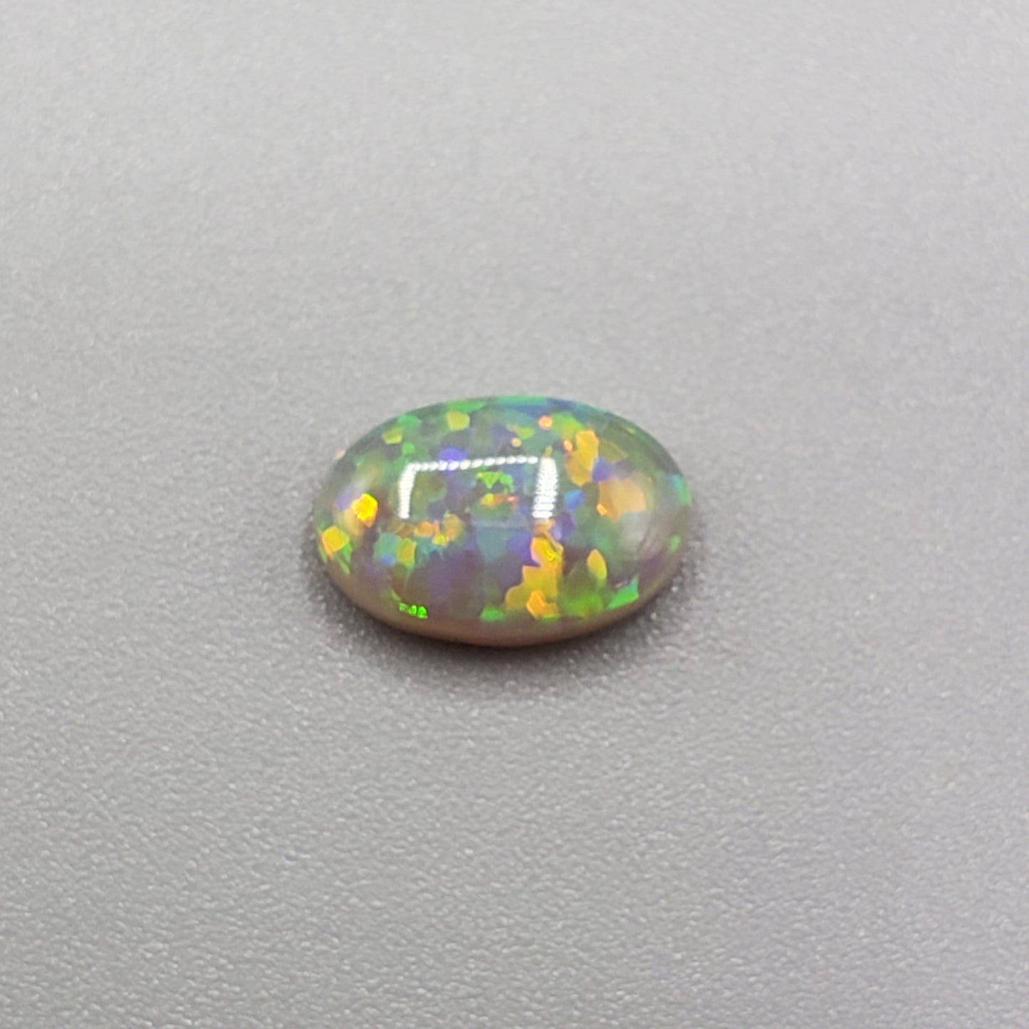 1.4cts Dark opal with a Green- Gold full facing floral pattern