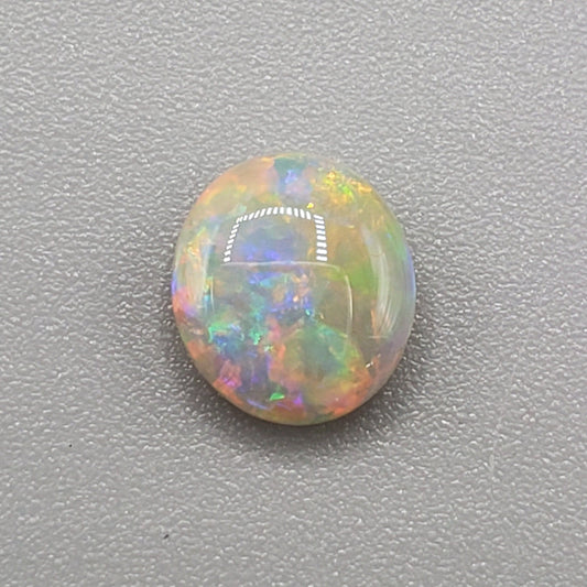 1.1 cts Dark opal with a sunset multi-color palette and lots of depth