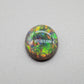 3.3cts Black opal with a rich Green-Orange color pallet and a paint brush stroke pattern.