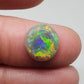 3.3cts Black opal with a rich Green-Orange color pallet and a paint brush stroke pattern.