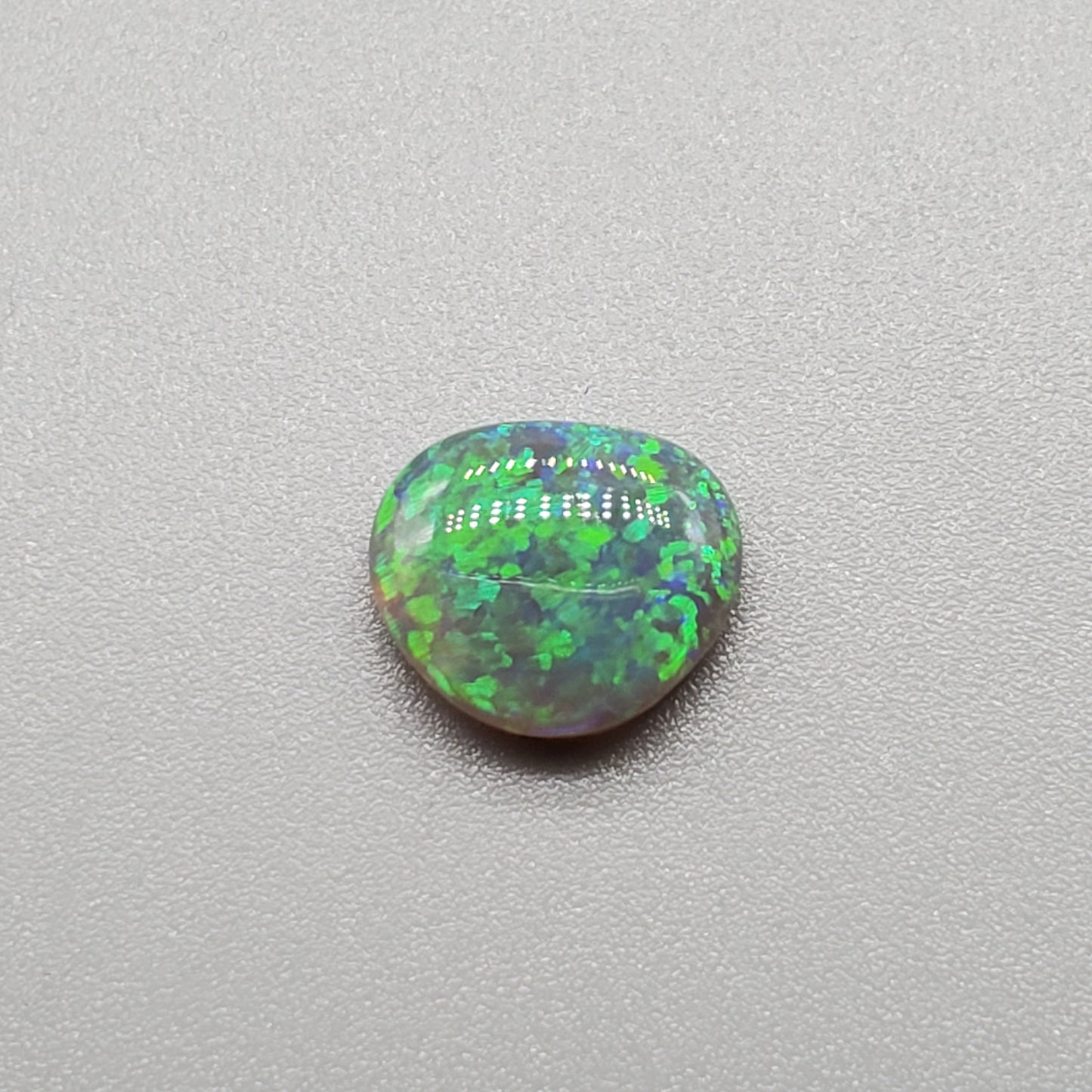 1.45cts Dark opal with rich Green floral pattern