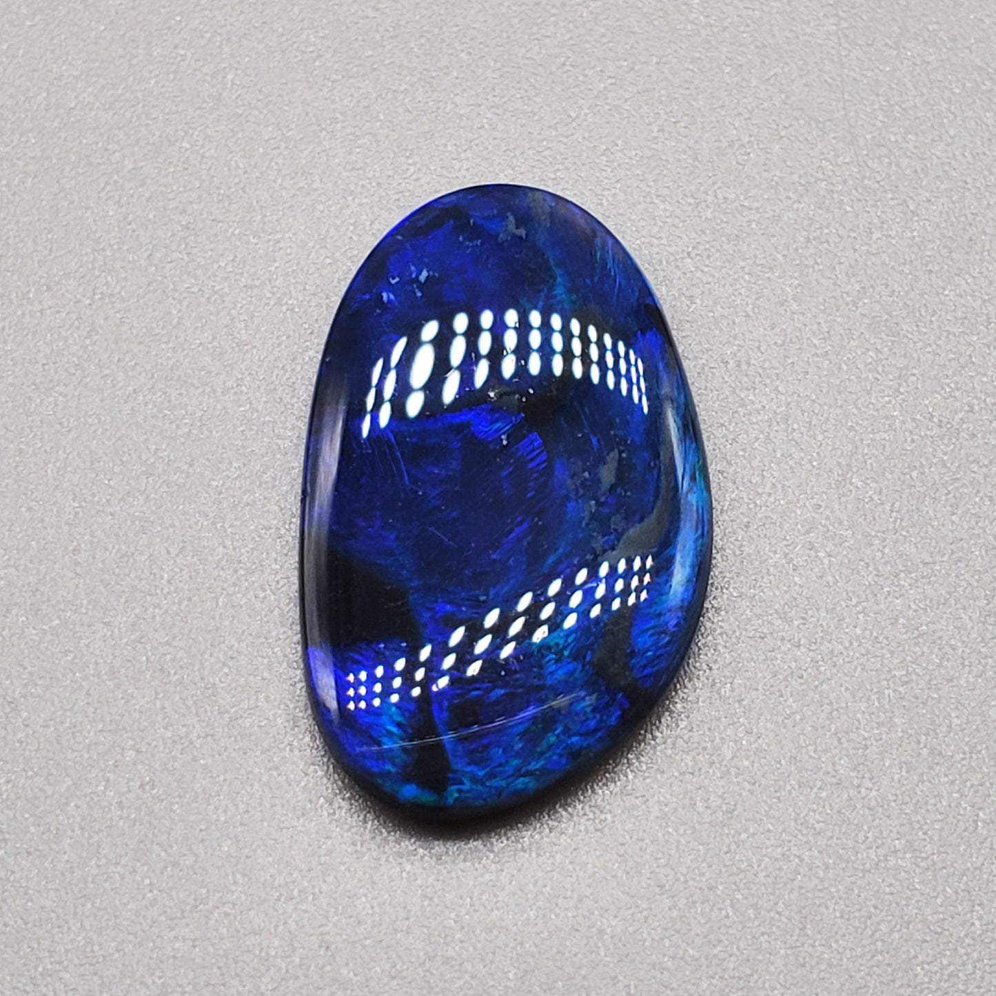 4.6ct Large Black opal with Blue color play and swirled small flash pattern