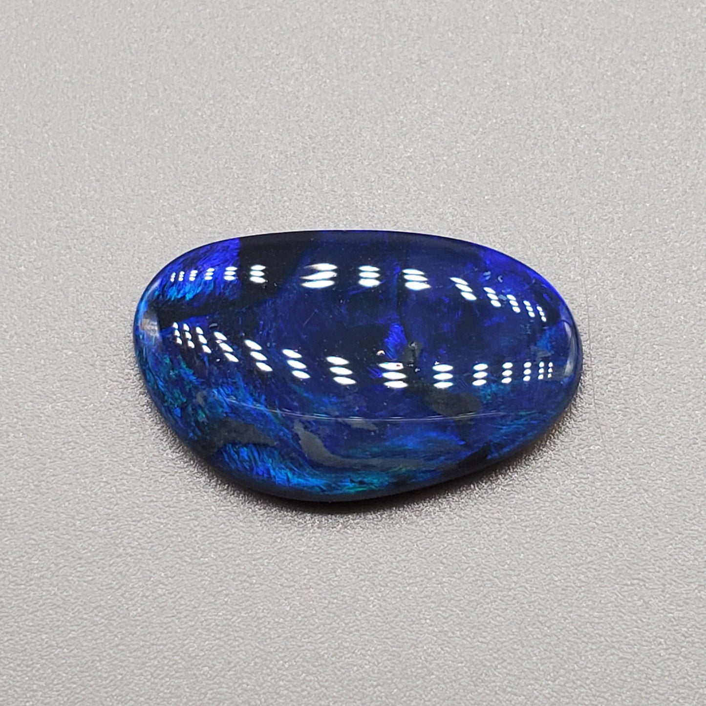 4.6ct Large Black opal with Blue color play and swirled small flash pattern