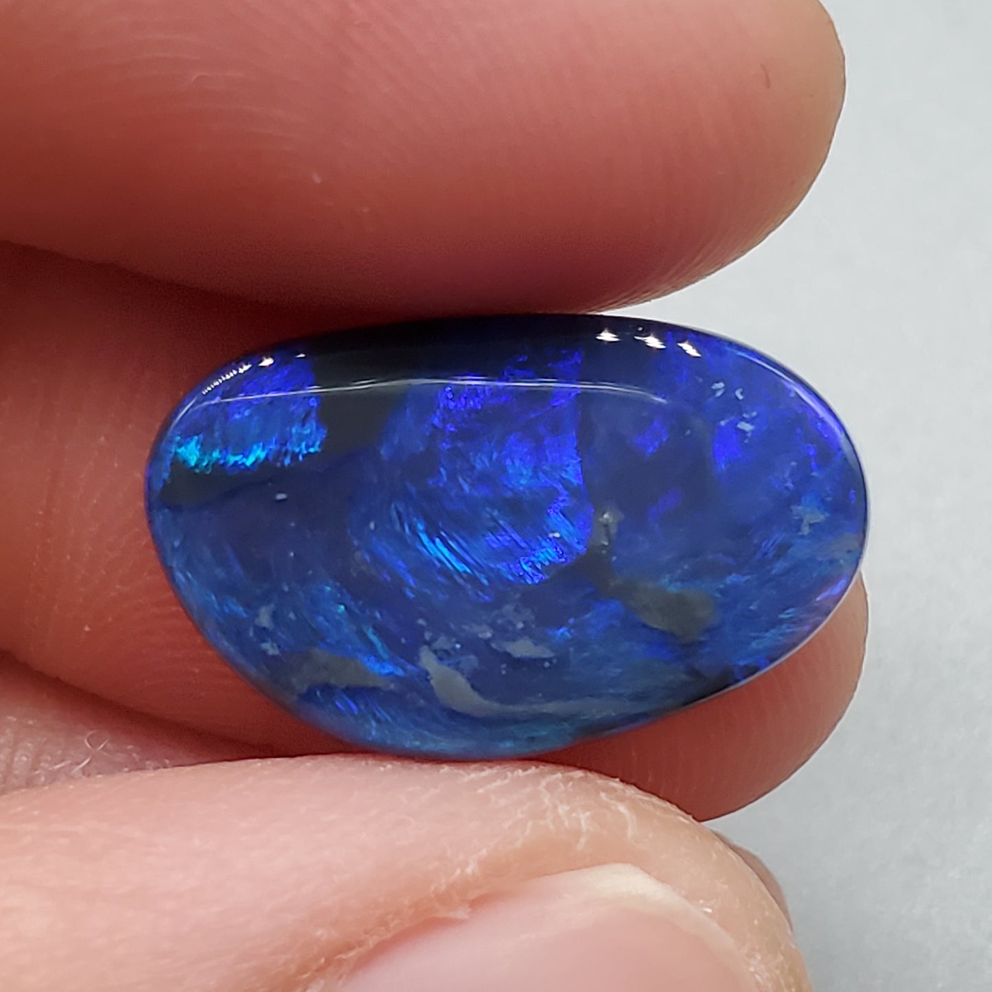 4.6ct Large Black opal with Blue color play and swirled small flash pattern