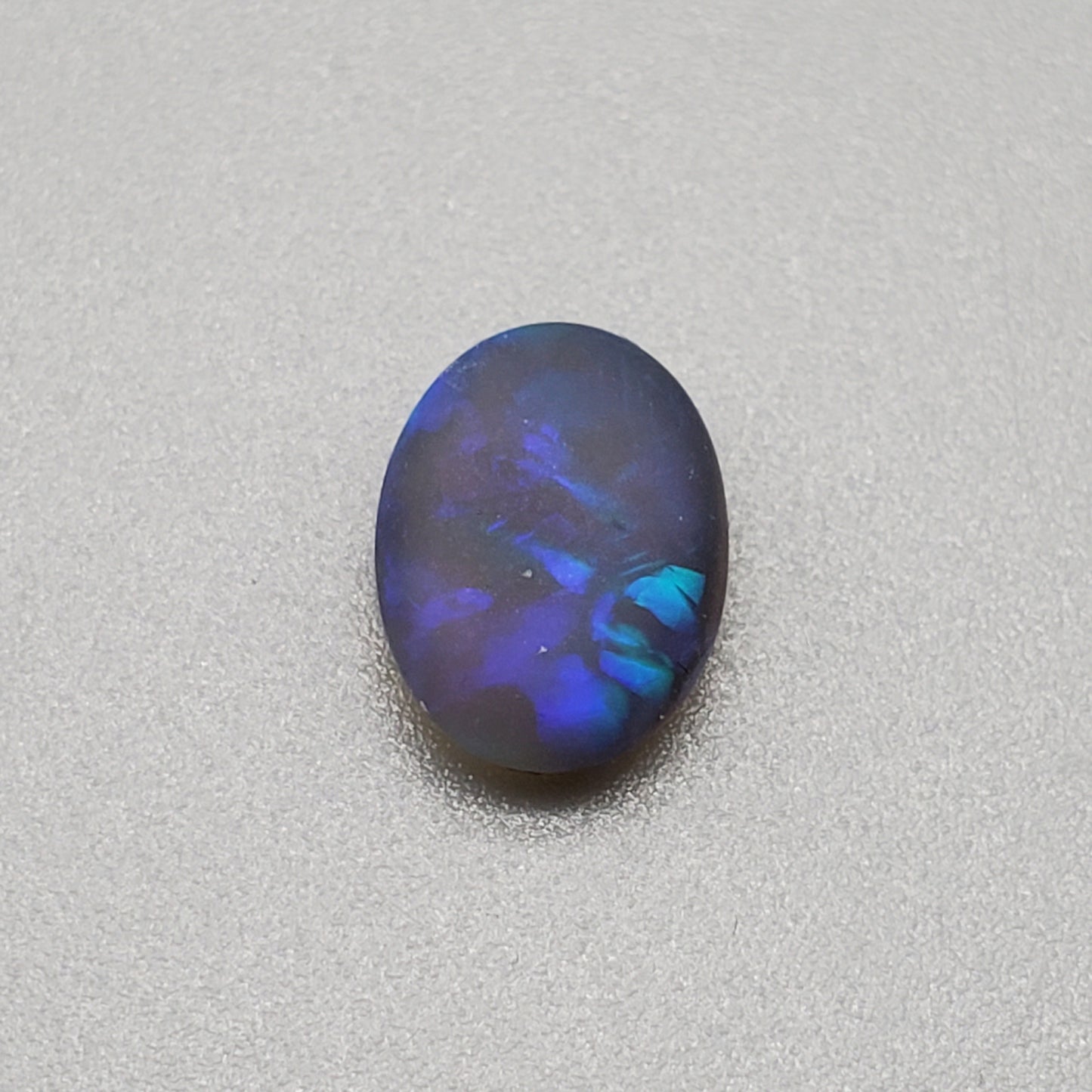 1.5cts Matte black crystal opal with subtle but rich blue green color play