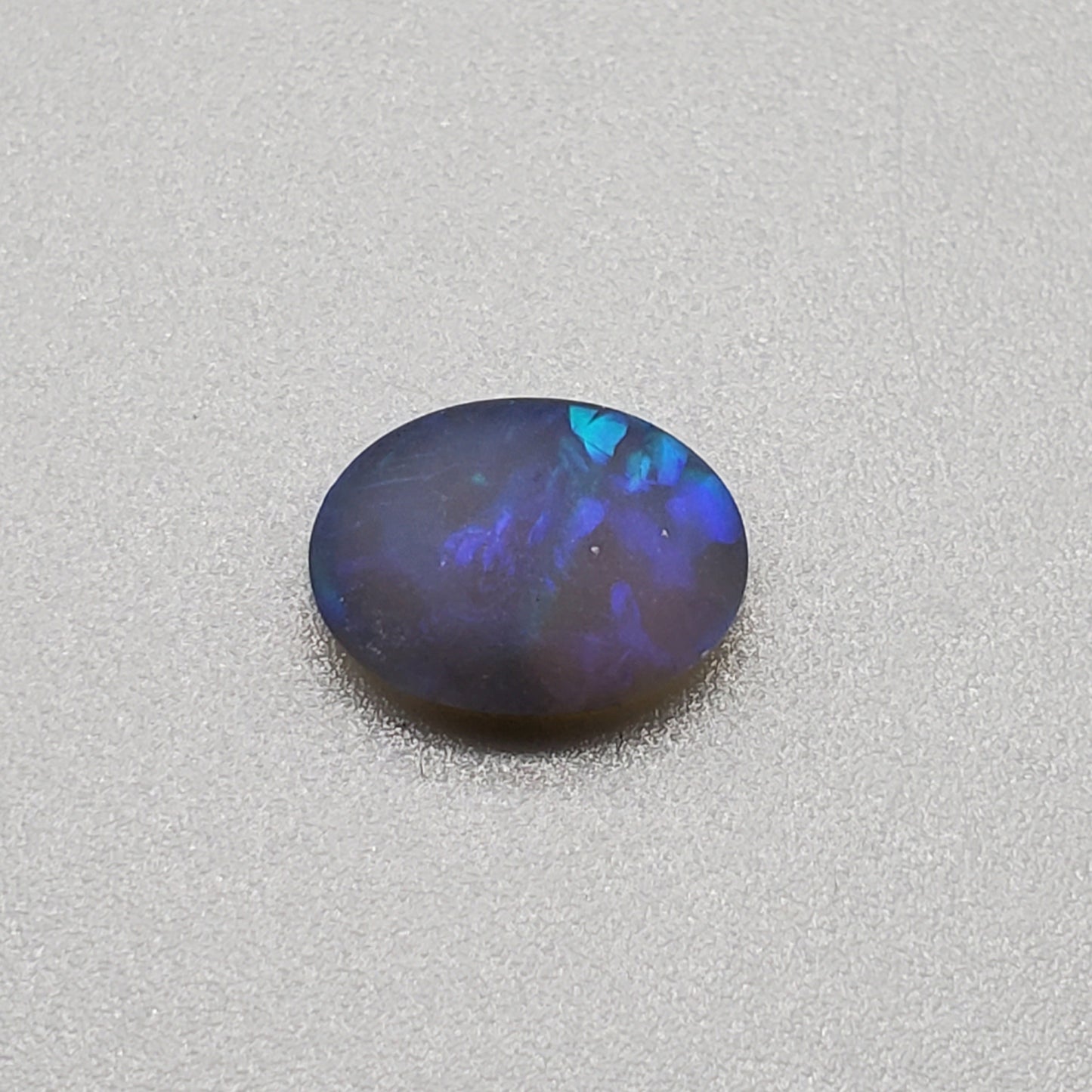 1.5cts Matte black crystal opal with subtle but rich blue green color play