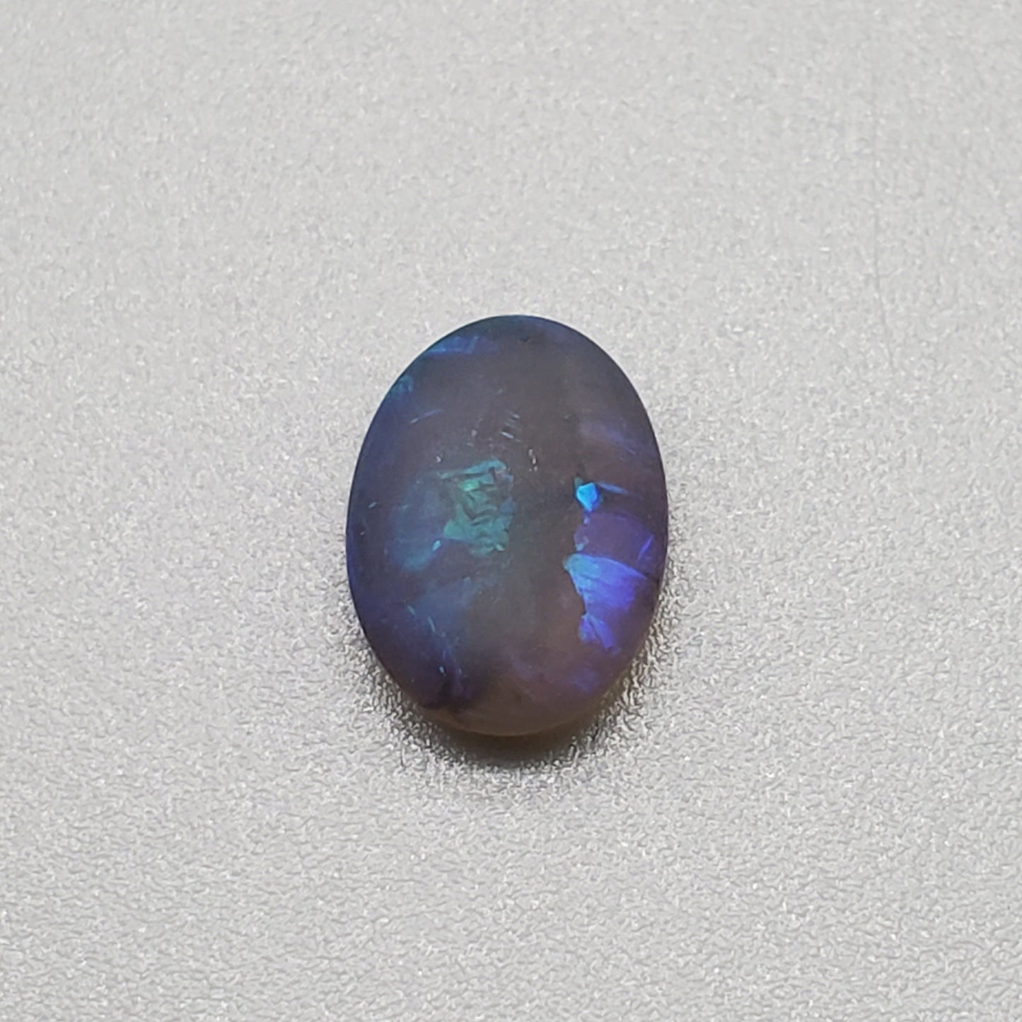 1.5cts Matte black crystal opal with subtle but rich blue green color play