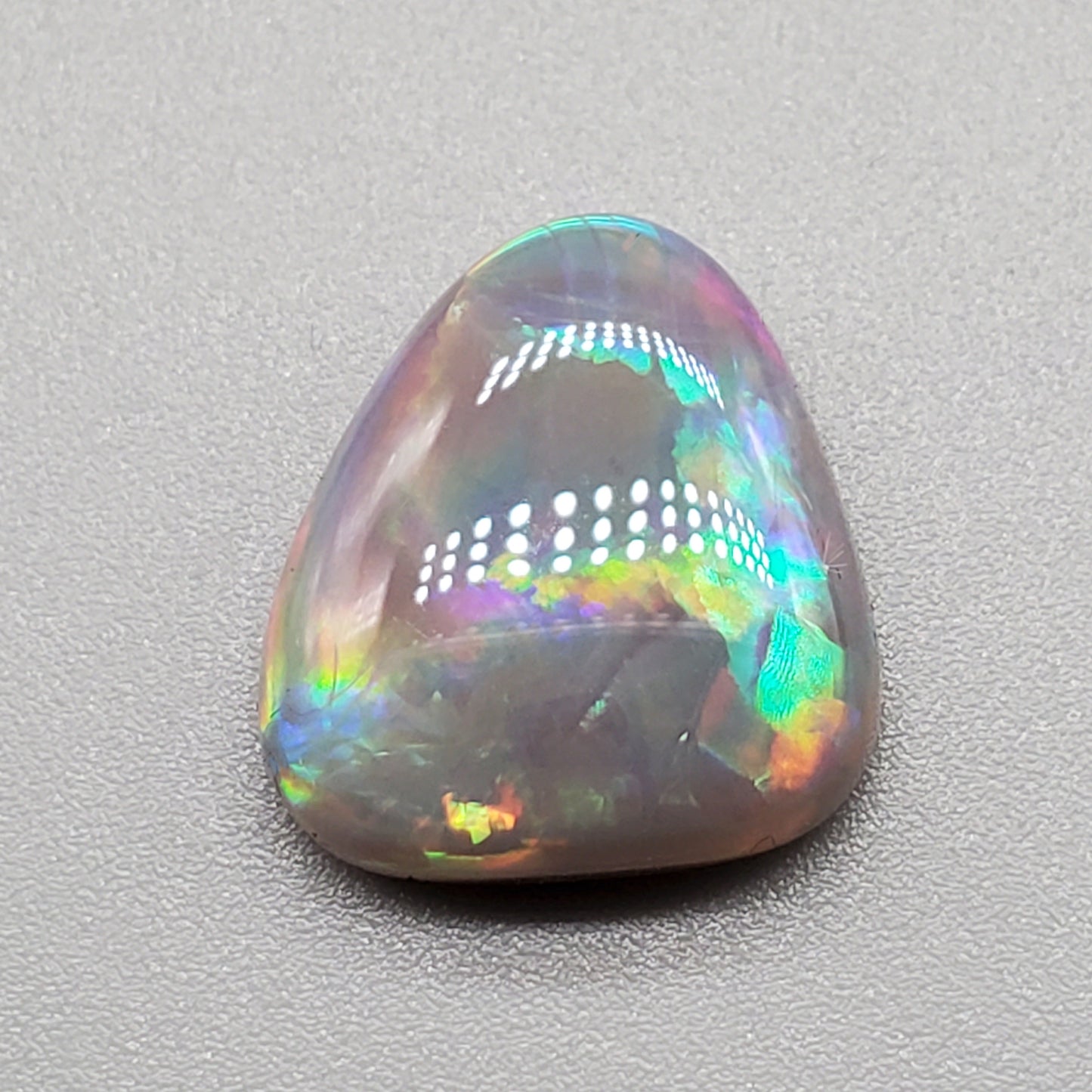 6.3cts Dark opal pastel color pallet and interesting rolling flash.