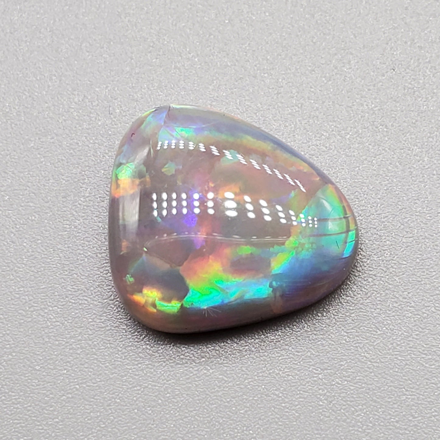 6.3cts Dark opal pastel color pallet and interesting rolling flash.