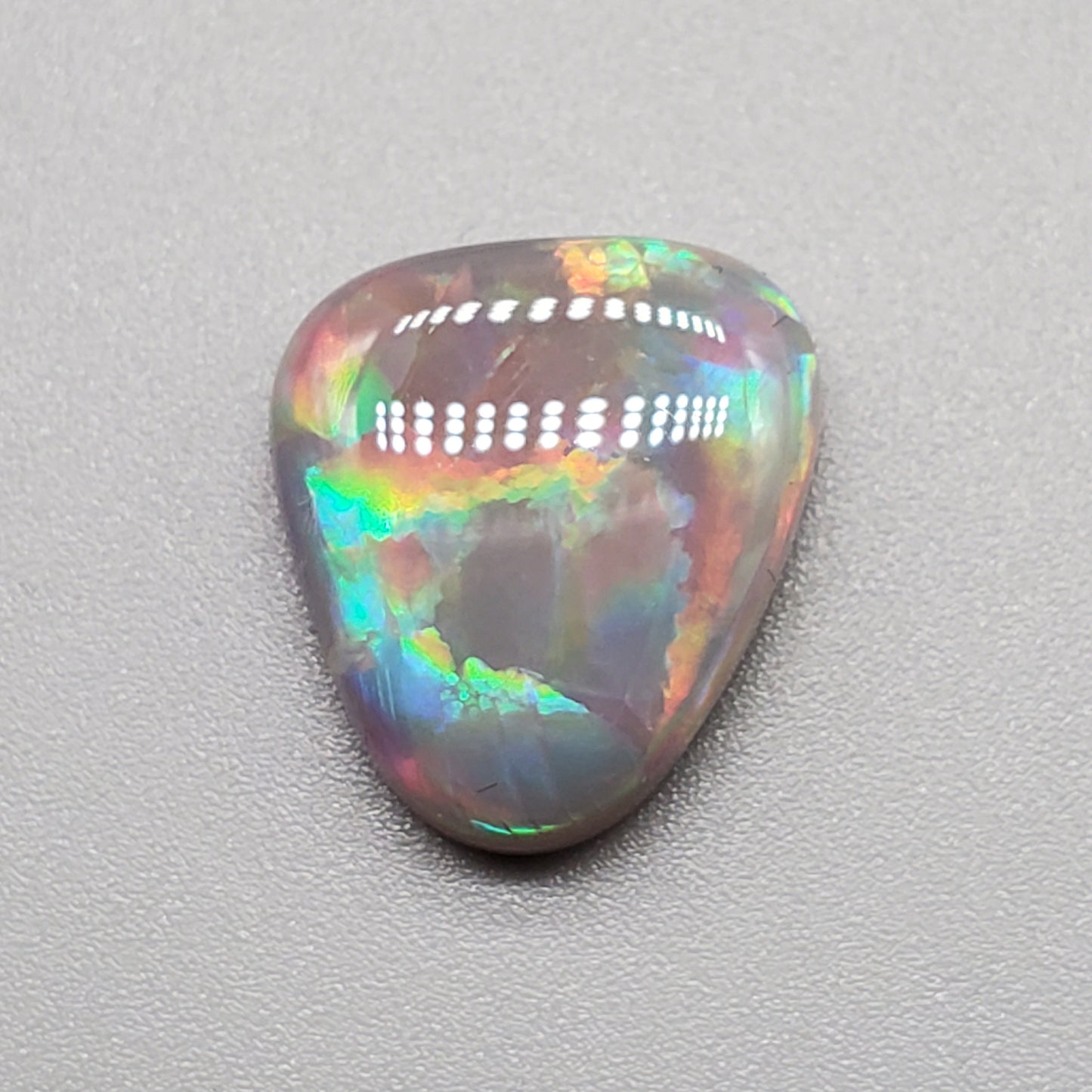 6.3cts Dark opal pastel color pallet and interesting rolling flash.