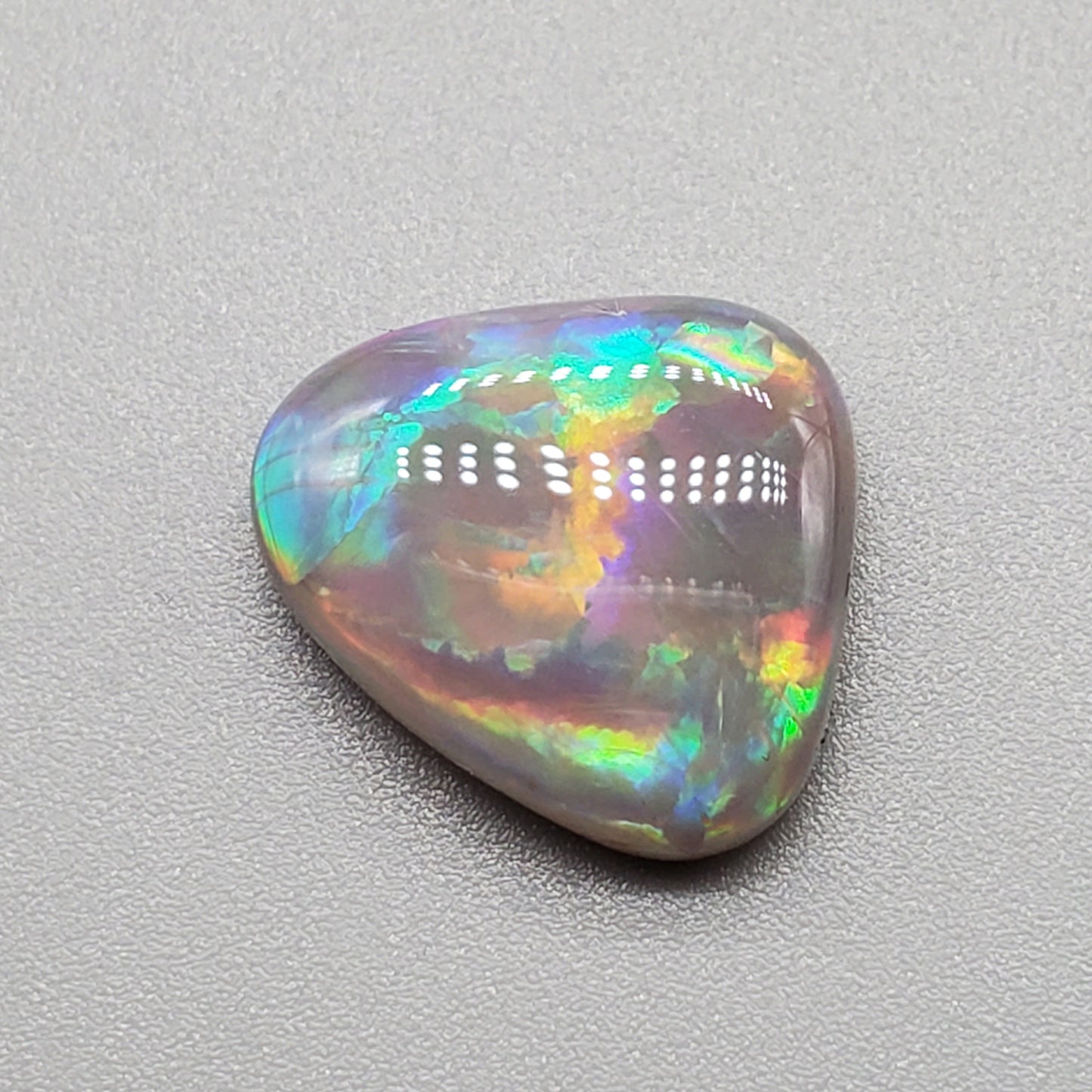 6.3cts Dark opal pastel color pallet and interesting rolling flash.