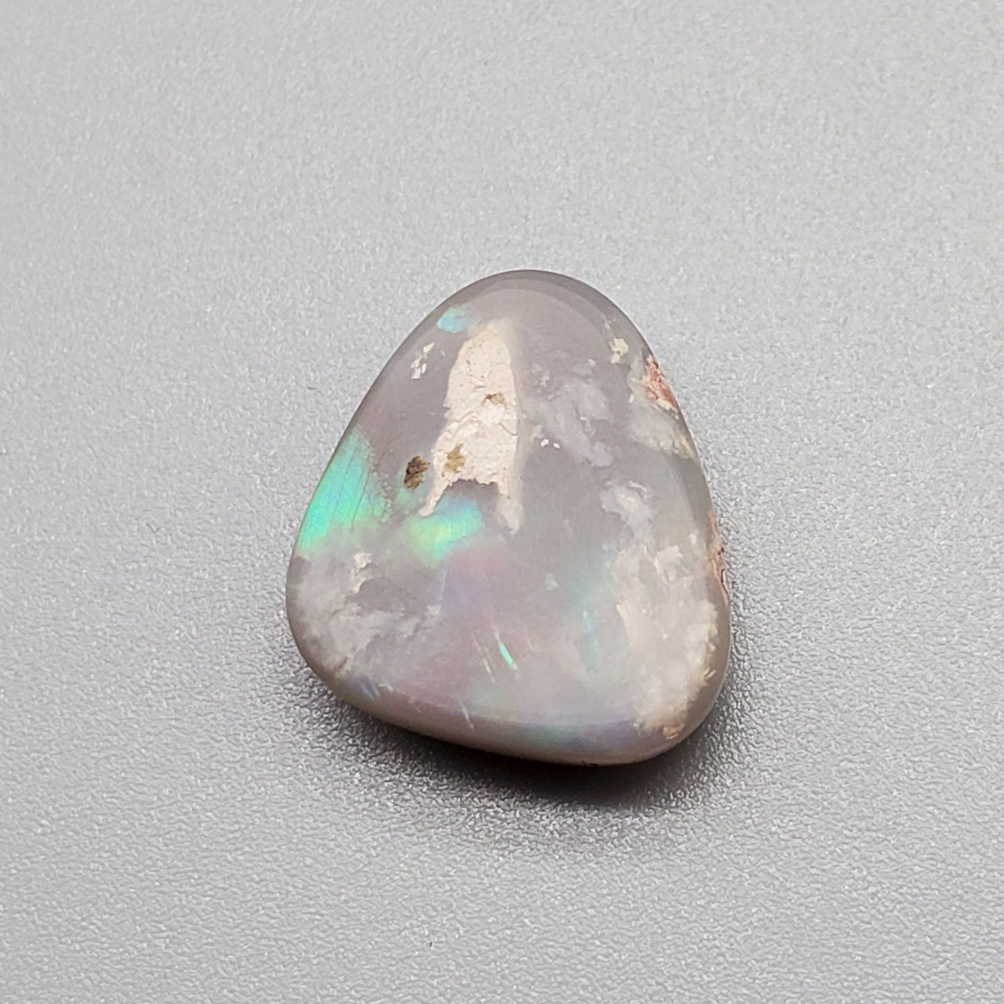 6.3cts Dark opal pastel color pallet and interesting rolling flash.