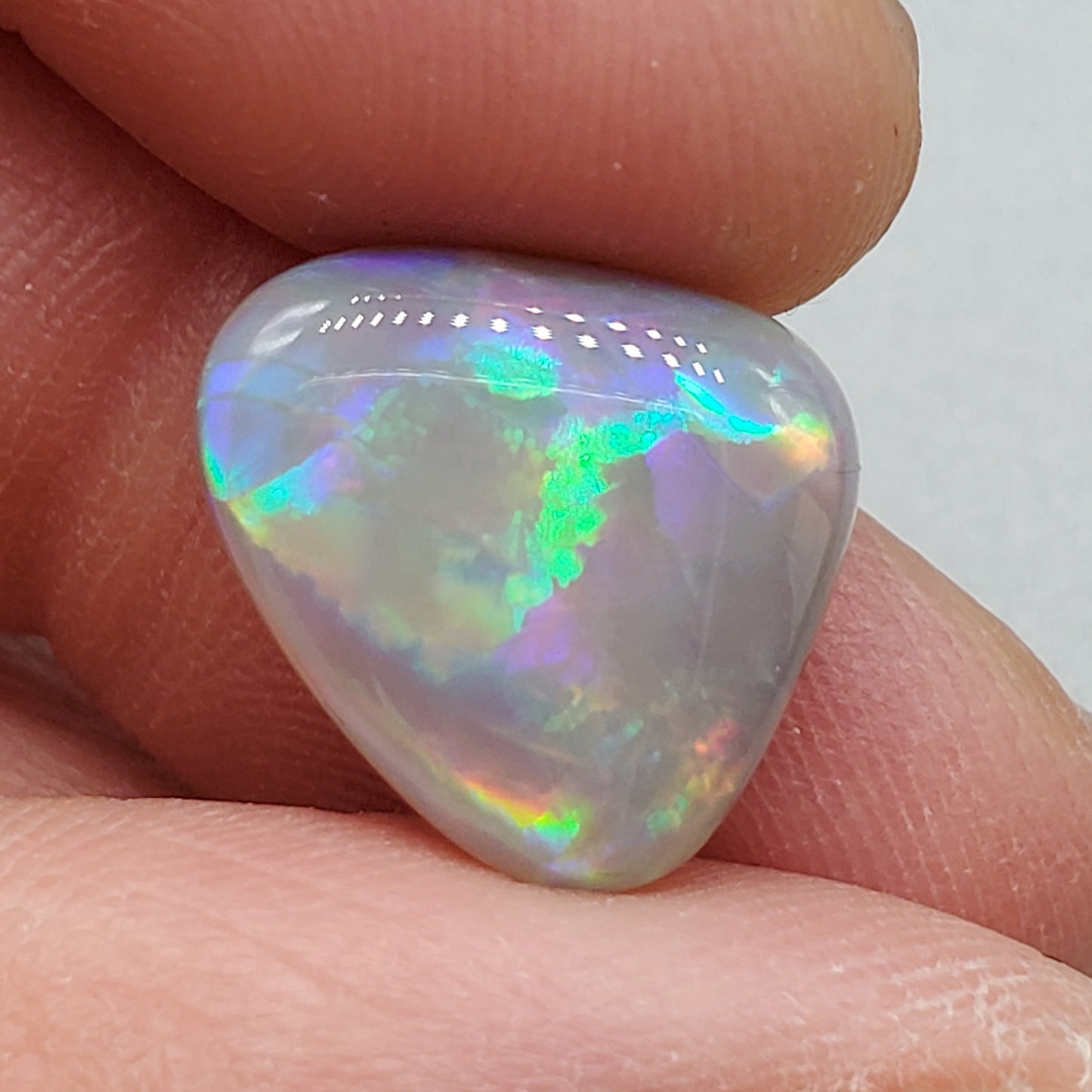 6.3cts Dark opal pastel color pallet and interesting rolling flash.