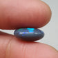 7cts Large Black Opal with well-dispersed, multi-shade Blue color play and an eye catching wispy pattern