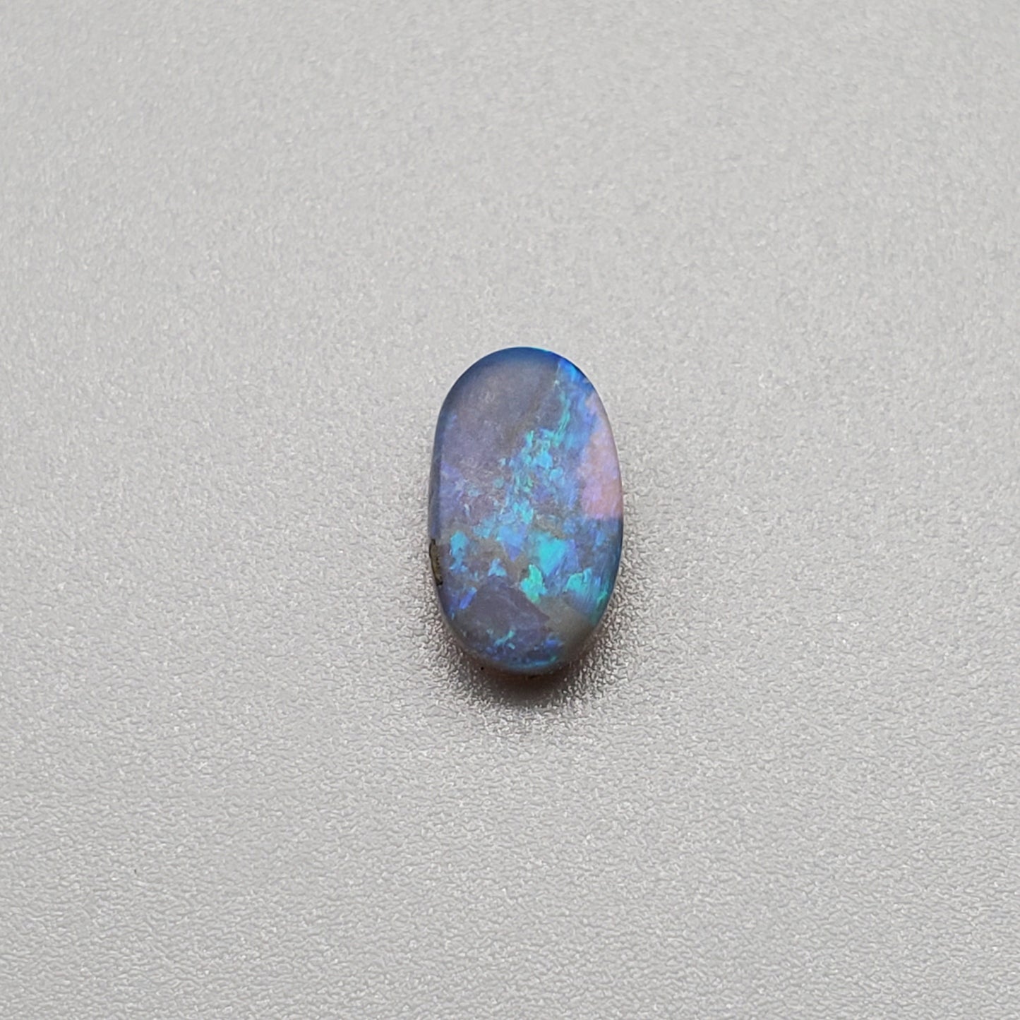 1.3cts Black Opal with Teal-blue rolling flash