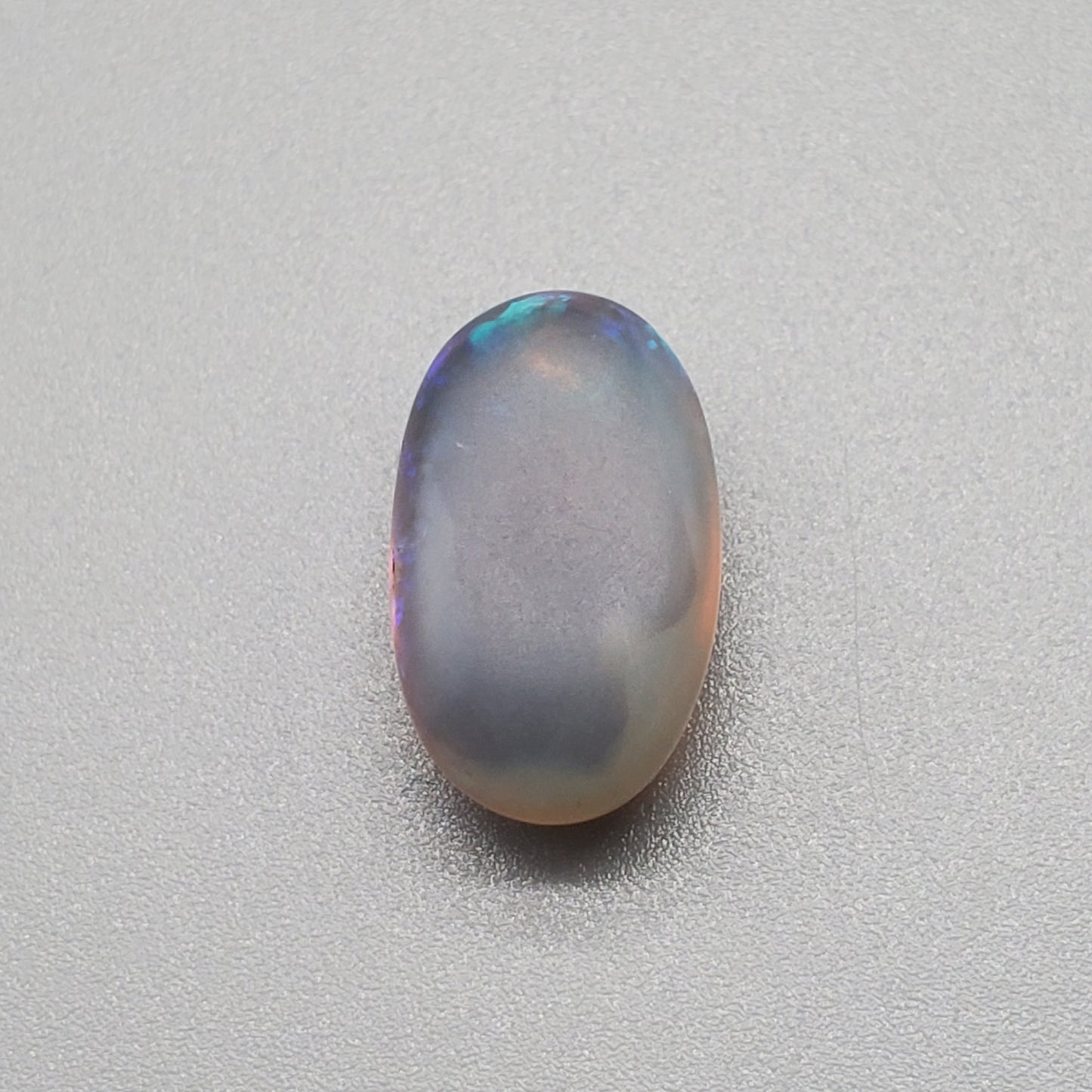 5.8cts Dark Crystal Opal with mixed blue color play large well dispersed patterning.