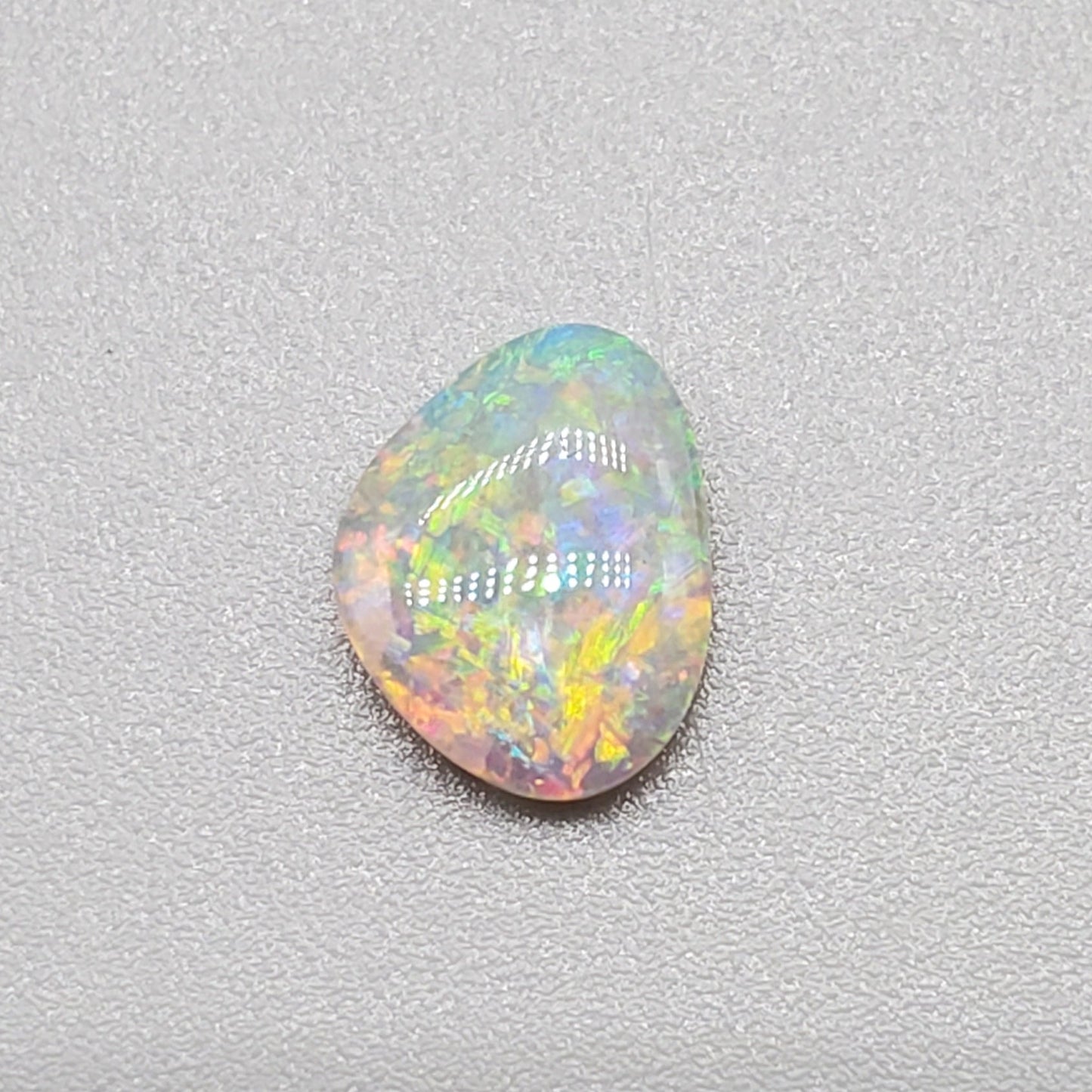 0.60cts Dark Opal with multi color palette and mixed pattern